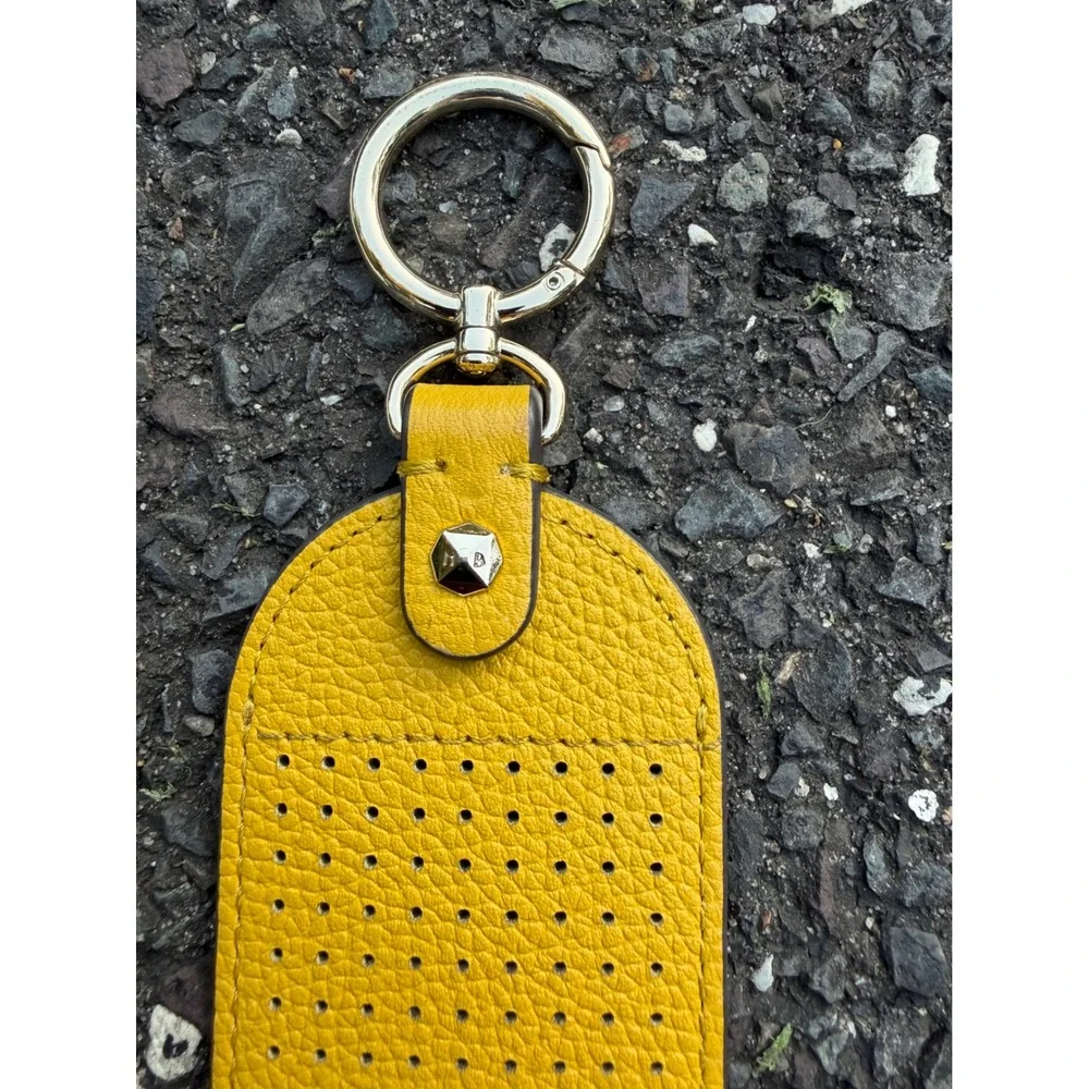 Henri Bendel Yellow Pebbled Leather Perforated Striped Keychain Bag Charm